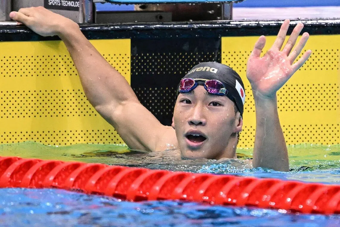 Japan’s Shin Ohashi celebrates after breaking the world record in the men’s 200m breaststroke at the Asian Games.