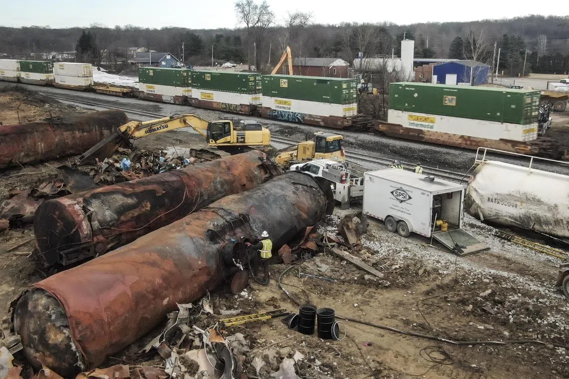 A freight train moves past as the cleanup continues following a freight train derailment in East Palestine, Ohio.