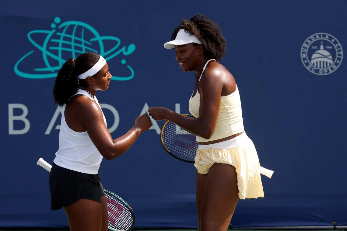 FILE PHOTO: Jul 21, 2025; Washington, D.C., USA; Venus Williams (USA)(R) and Hailey Baptiste (USA)(R) celebrate after winning a point against Eugenie Bouchard (CAN) and Clervie Ngounoue (USA) (both not pictured) in a women's doubles match on day one of the Mubadala Citi DC Open at Rock Creek Park Tennis Center. Mandatory Credit: Geoff Burke-Imagn Images/File Photo