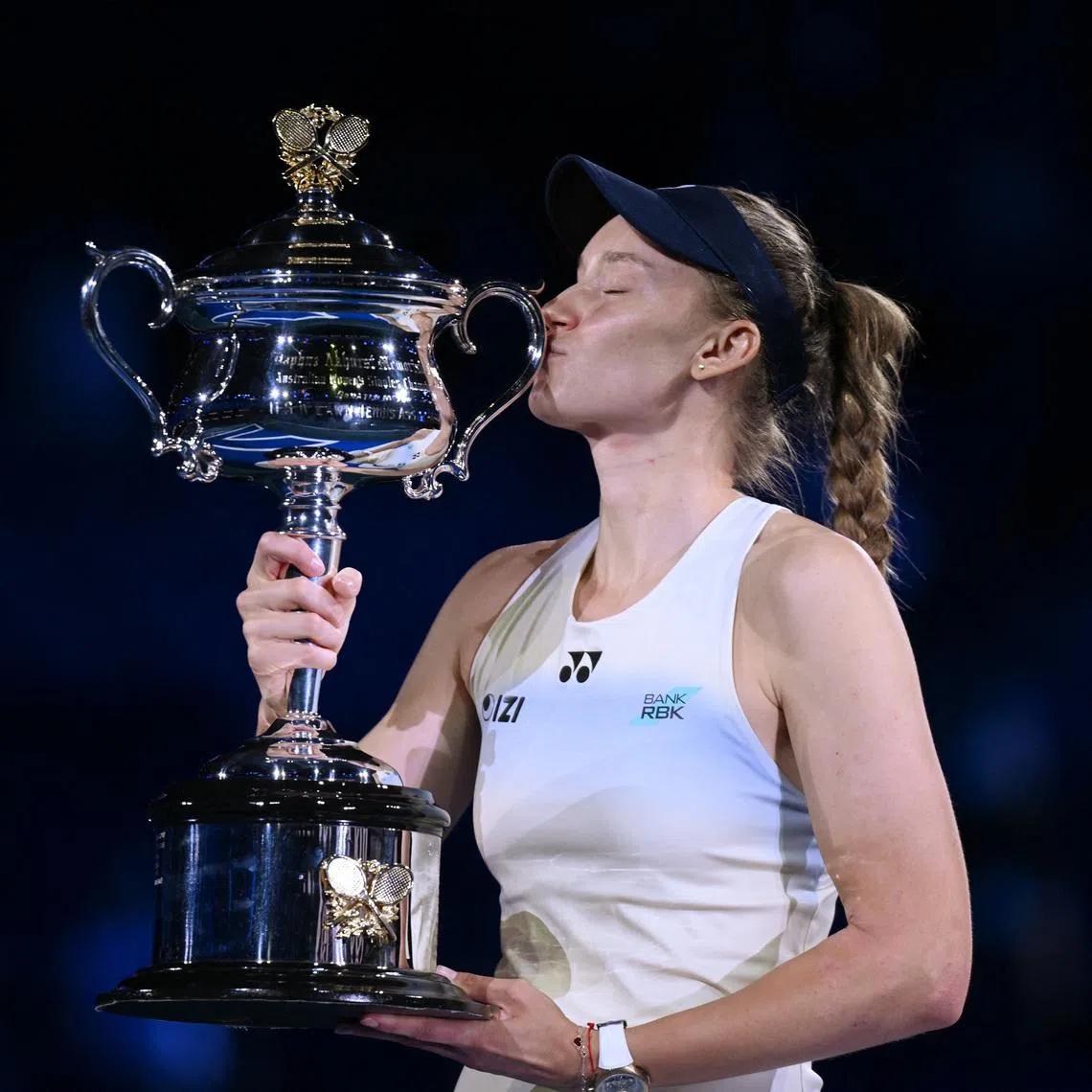 Tennis - Australian Open - Melbourne Park, Melbourne, Australia - January 31, 2026 Kazakhstan's Elena Rybakina kisses with the trophy after winning her women's singles final against Belarus' Aryna Sabalenka REUTERS/Jaimi Joy
