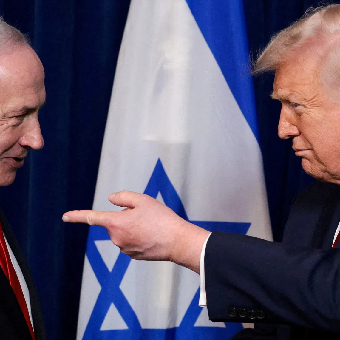 FILE PHOTO: U.S. President Donald Trump points his finger towards Israeli Prime Minister Benjamin Netanyahu during a press conference after meeting at Trump’s Mar-a-Lago club in Palm Beach, Florida, U.S., December 29, 2025. REUTERS/Jonathan Ernst/File Photo