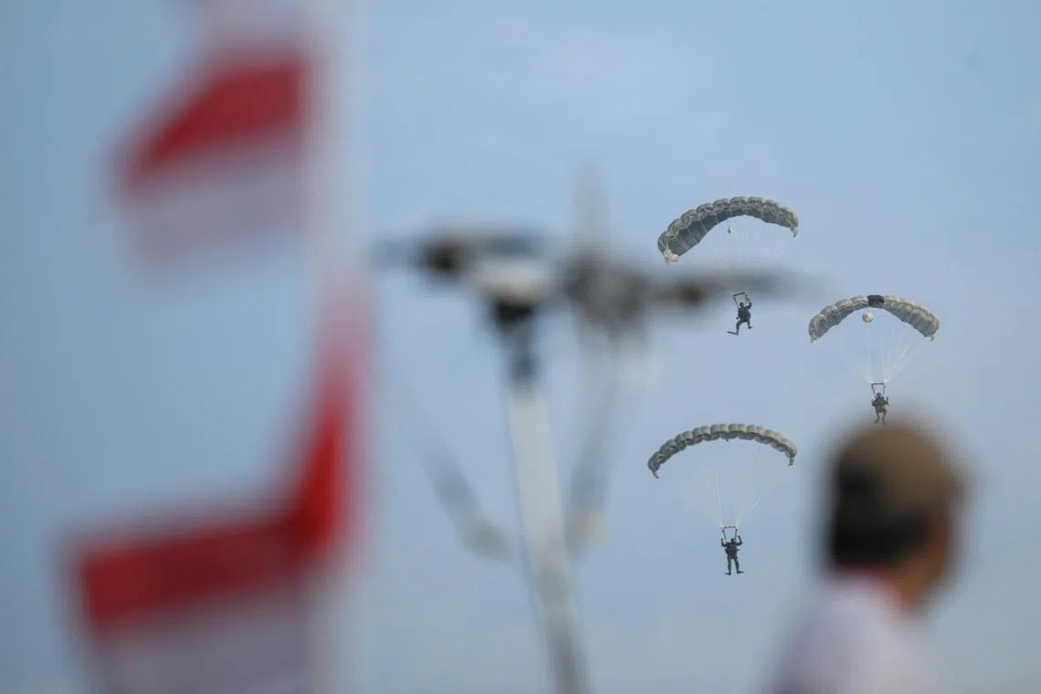 Naval divers performing the inaugural Jump of Unity, a new offering in the pre-parade segment for National Day Parade (NDP) 2025, at the National Education (NE) Show 2 on July 5.