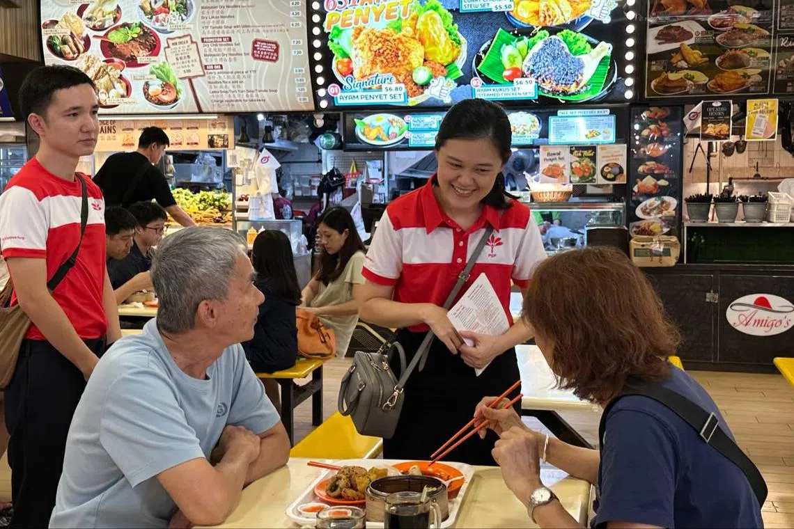 Progress Singapore Party candidate Stephanie Tan speaking to residents during a walkabout in Pioneer on April 26.