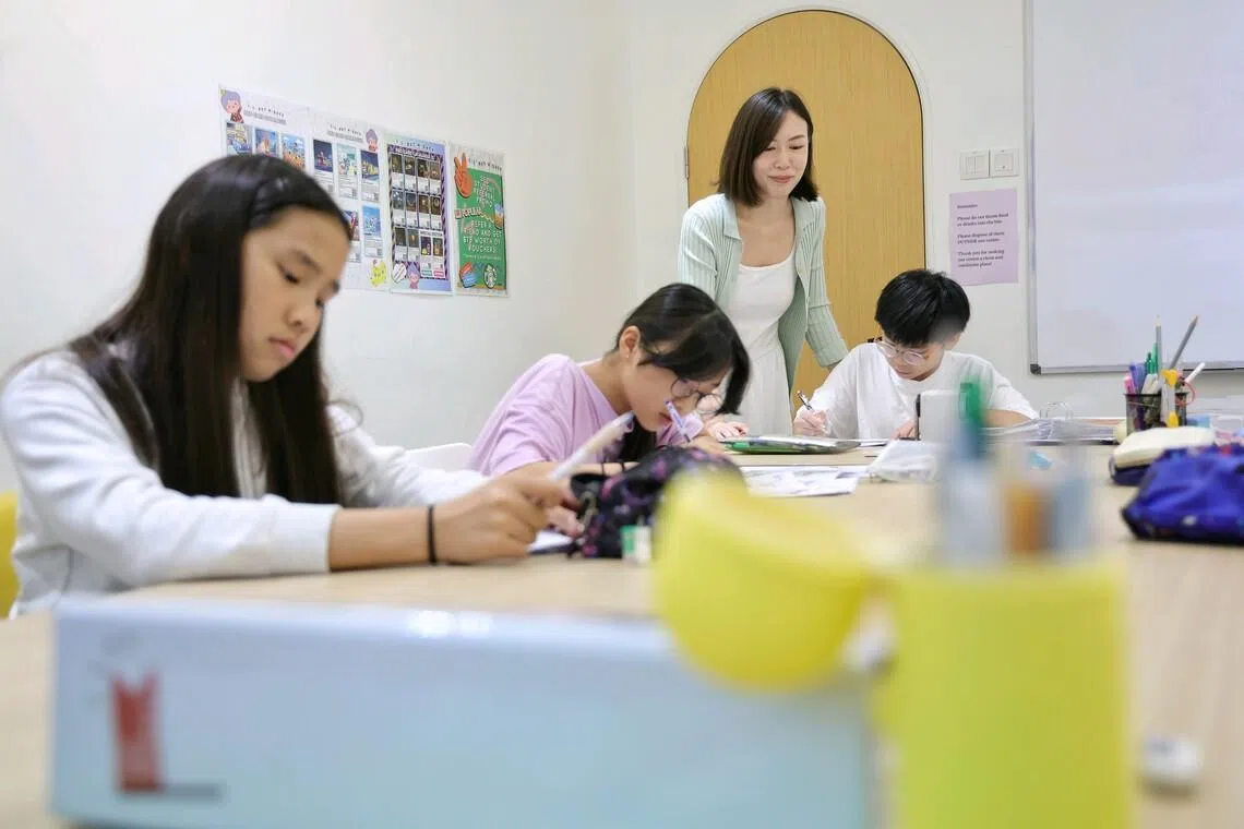 Delia Siow, head of Primary English Curriculum at Lil’ but Mighty English tuition centre, at a class for Primary 6 pupils at Bukit Timah Shopping Centre on June 8.