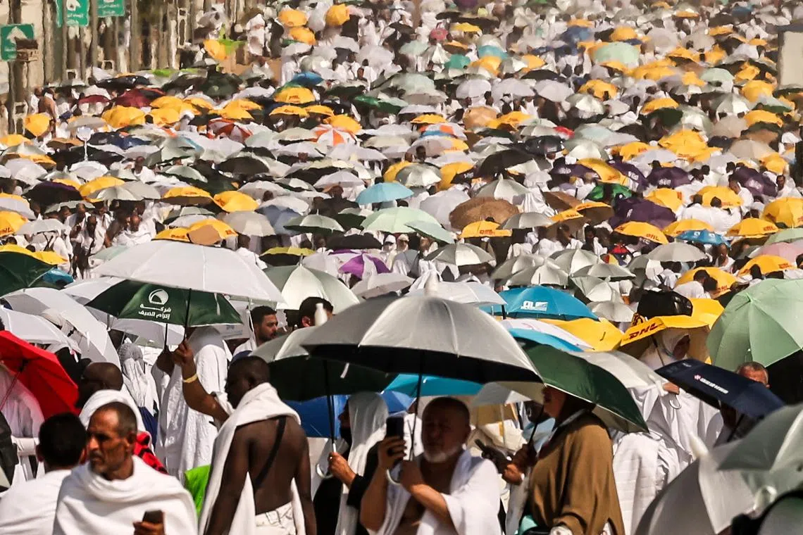 Muslims arrive at the base of Mount Arafat, also known as Jabal al-Rahma or Mount of Mercy, during the annual hajj pilgrimage on June 15.