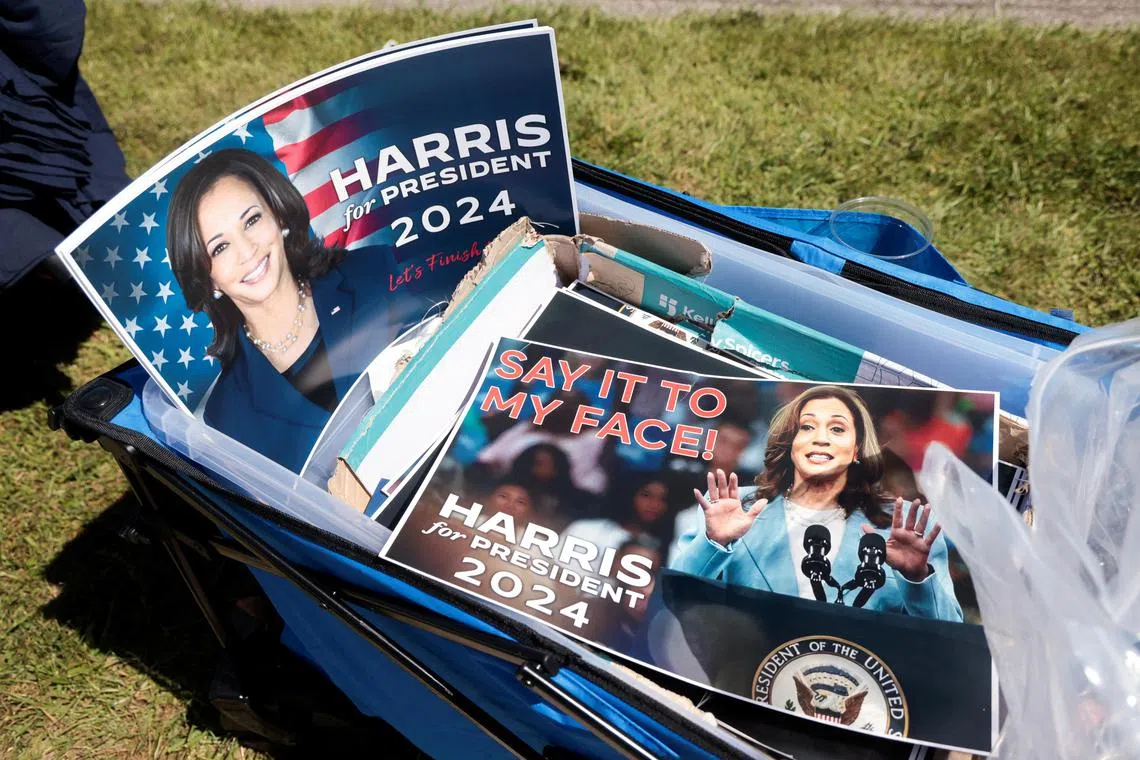 A 'Say it to my face' campaign poster of Democratic presidential nominee and U.S. Vice President Kamala Harris is seen for sale outside the site of a campaign stop in Detroit, Michigan U.S., September 2, 2024.  REUTERS/Rebecca Cook