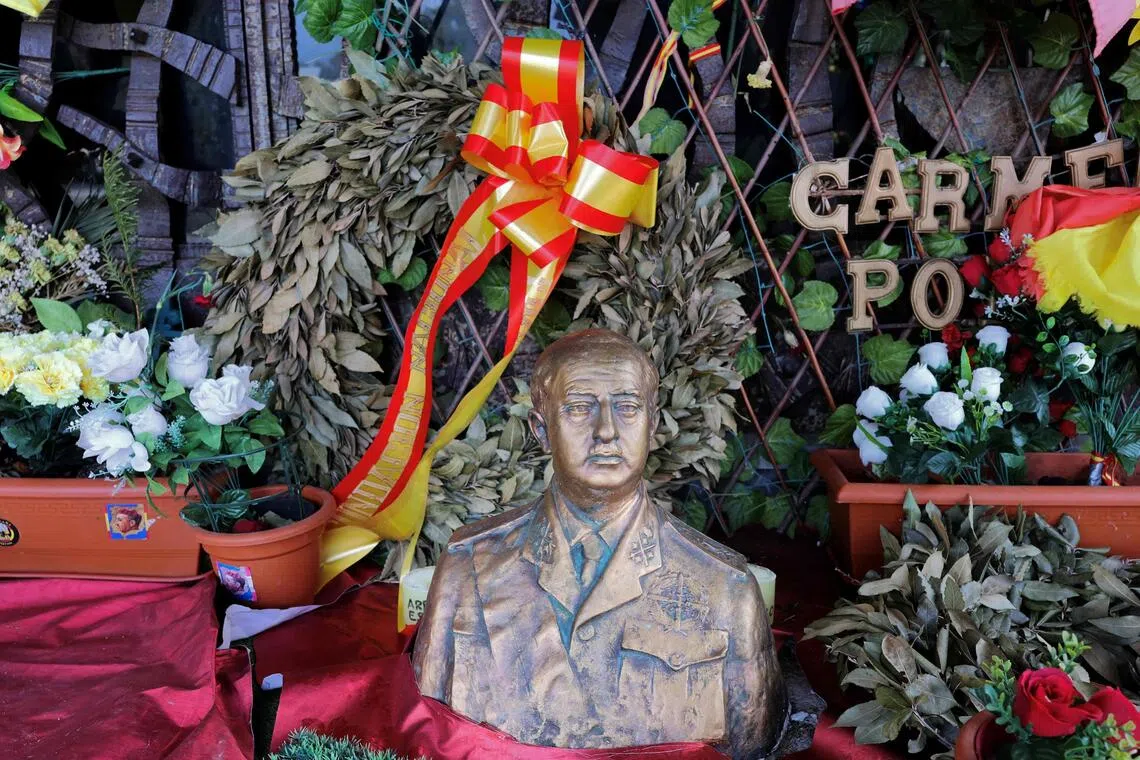 A bust of Spanish dictator Francisco Franco at his mausoleum in Madrid, decorated with flags and messages left by supporters.