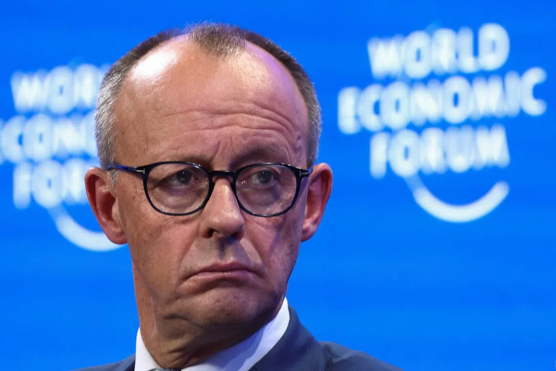FILE PHOTO: German conservative candidate for chancellor and Christian Democratic Union (CDU) leader Friedrich Merz looks on during the 55th annual World Economic Forum (WEF) meeting in Davos, Switzerland, January 21, 2025. REUTERS/Yves Herman/File Photo