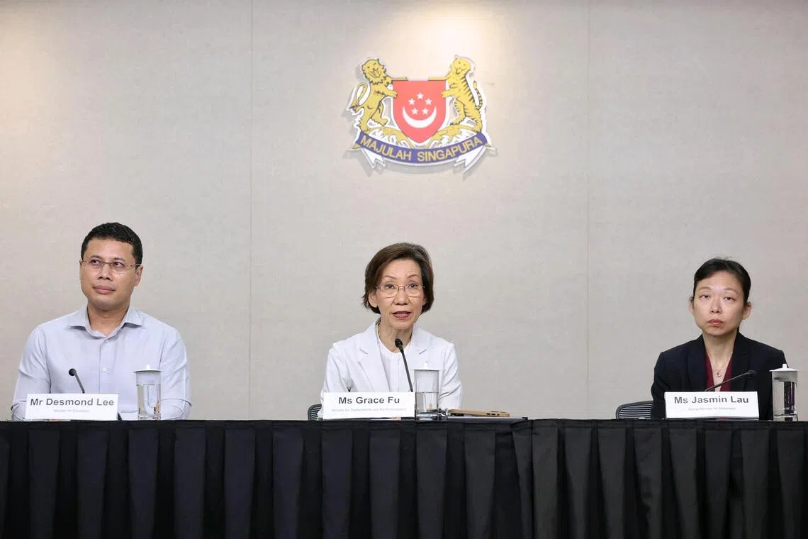 (EMBARGO LIFTS AT THE END OF THE PRESS CONFERENCE) (From left) Education Minister Desmond Lee, Minister for Sustainability and the Environment Grace Fu, and Acting Minister for Manpower Jasmin Lau speaking about the current haze situation during a press conference at the National Press Centre on Oct 16, 2026. The press conference covers the forecasted haze situation in the coming weeks, protective measures for stakeholders across various sectors based on prevailing air quality, and updates on Si
