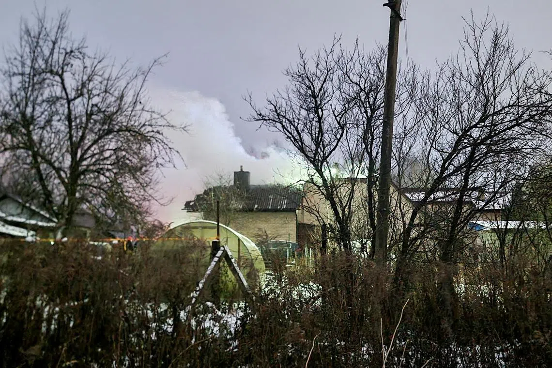 Smoke billows following a DHL cargo plane crash in Vilnius, Lithuania, November 25, 2024. REUTERS/Andrius Sytas