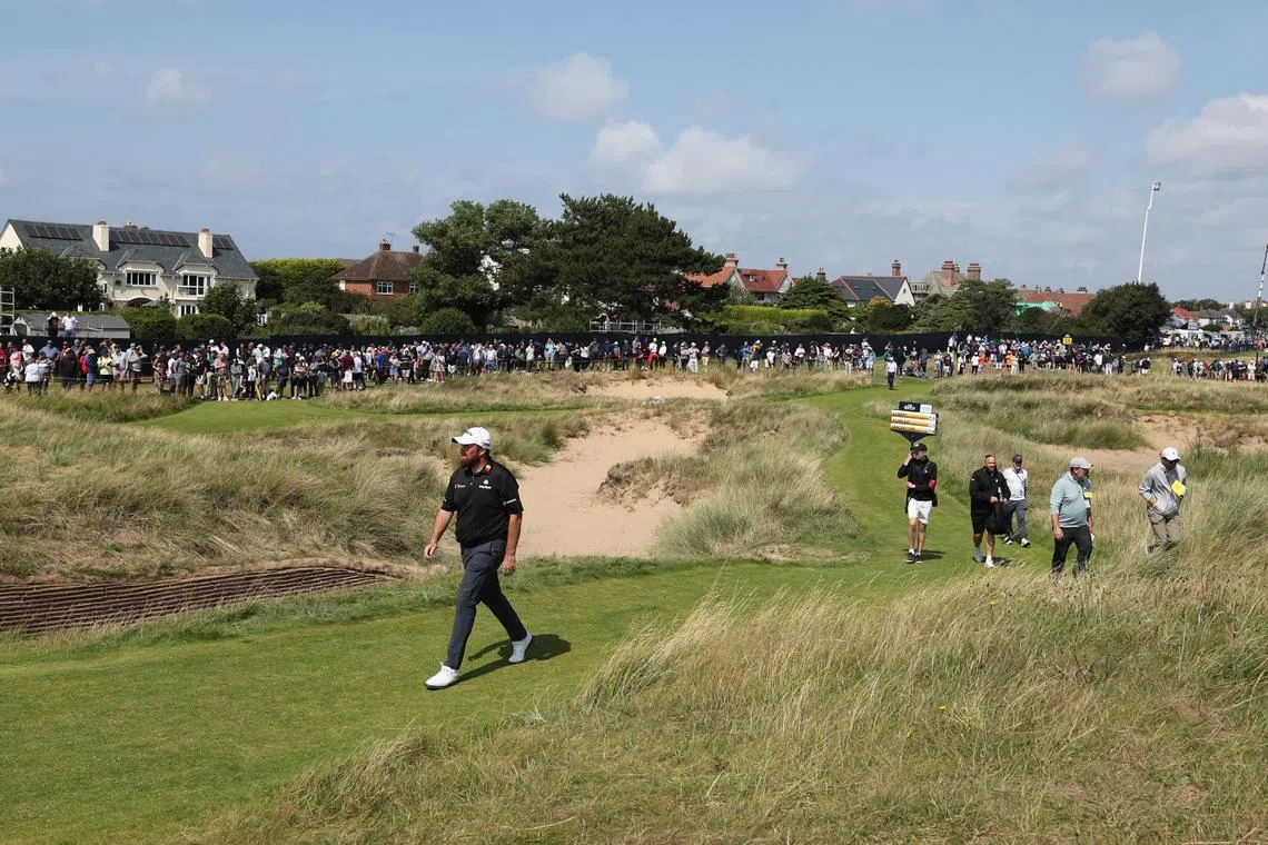 Ireland's Shane Lowry walks up the 17th hole during the British Open first round.