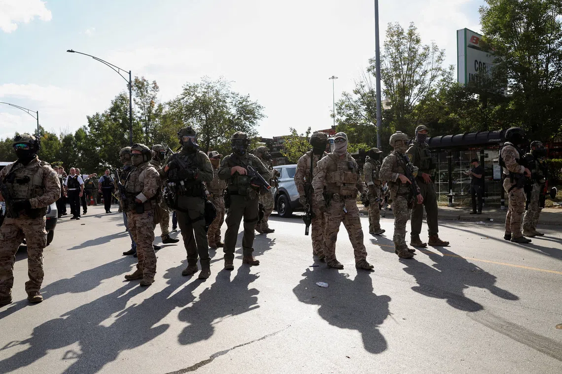 FILE PHOTO: Law enforcement officers operate during a standoff with U.S. Immigration and Customs Enforcement (ICE) and federal officers in the Little Village neighborhood of Chicago, Illinois, U.S., October 4, 2025. REUTERS/Jim Vondruska/File Photo