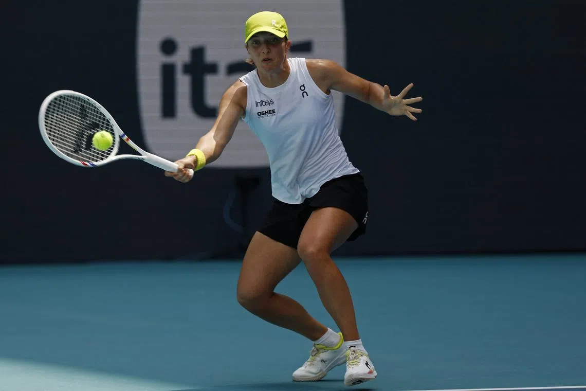 FILE PHOTO: Mar 26, 2025; Miami, FL, USA; Iga Swiatek (POL) hits a forehand against Alexandra Eala (PHL)(not pictured) on day nine of the Miami Open at Hard Rock Stadium. Mandatory Credit: Geoff Burke-Imagn Images/File Photo