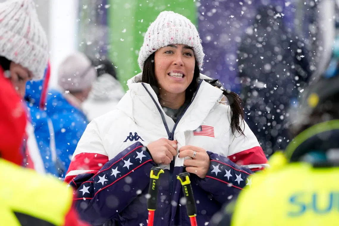 Feb 7, 2026; Cortina d'Ampezzo, ITALY; United States skier Bella Wright puts on a jacket during women's alpine skiing downhill training the Milano Cortina 2026 Olympic Winter Games at Tofane Alpine Skiing Centre. Mandatory Credit: Michael Madrid-Imagn Images