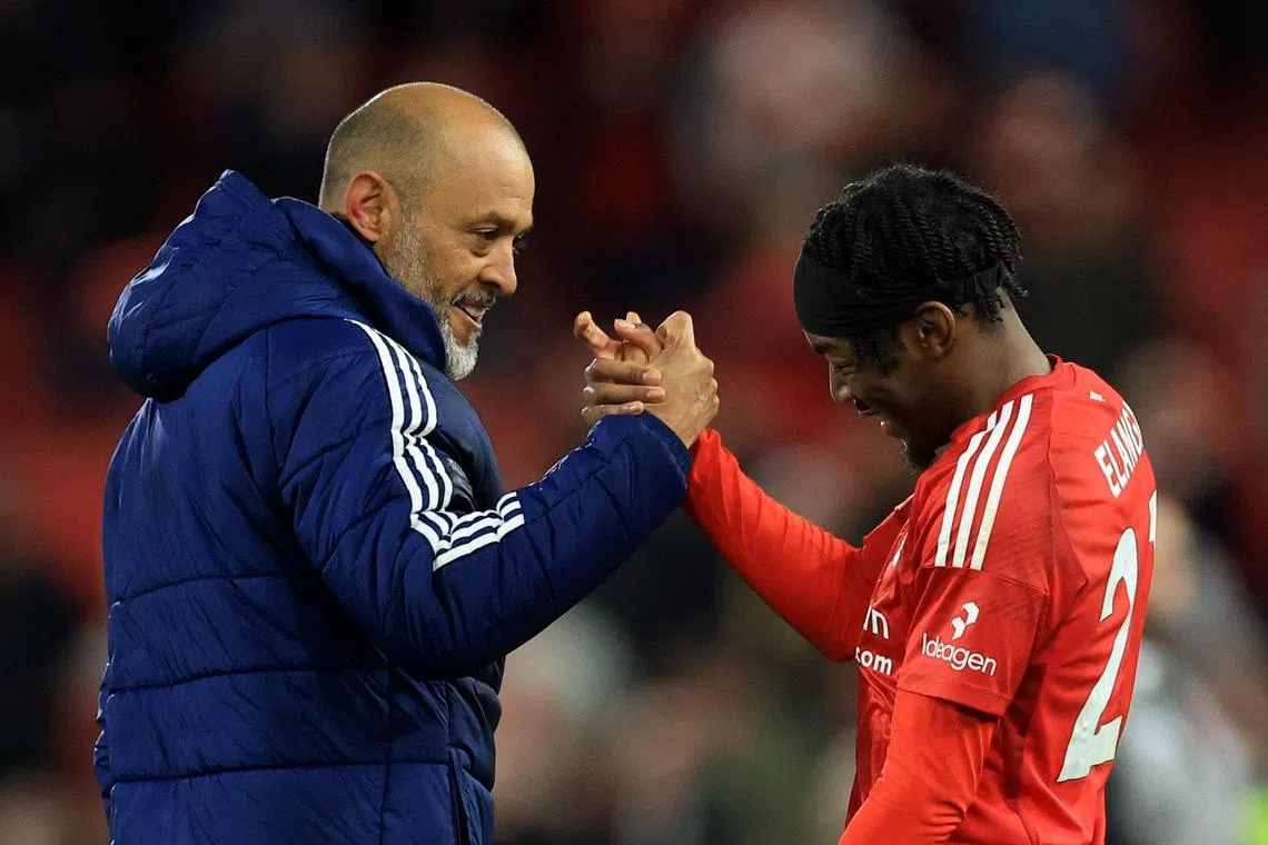 Nottingham Forest manager Nuno Espirito Santo and Anthony Elanga celebrate after the match.