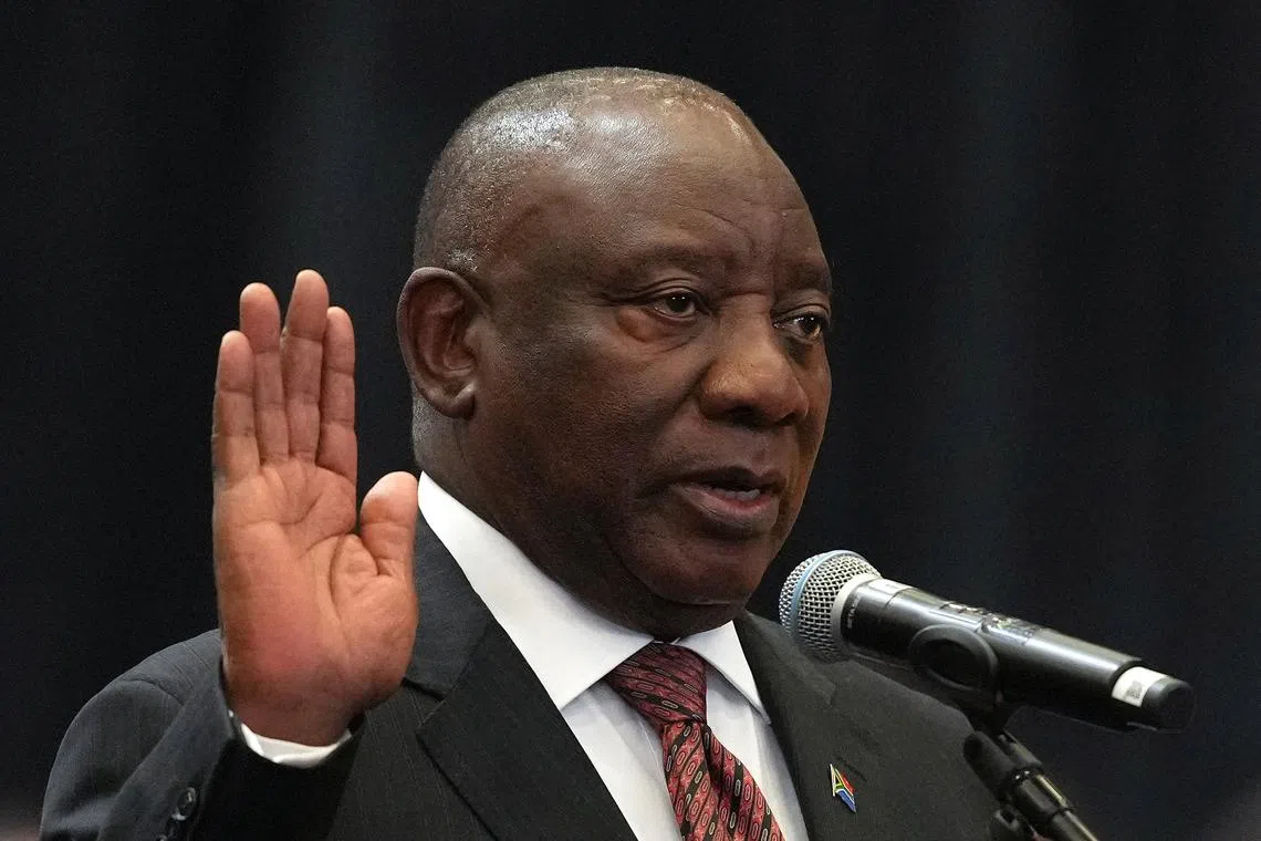 South African President Cyril Ramaphosa is sworn into the National Assembly during the first sitting of the National Assembly following elections at the Cape Town International Convention Center (CTICC) in Cape Town, South Africa, June 14, 2024. REUTERS/Nic Bothma