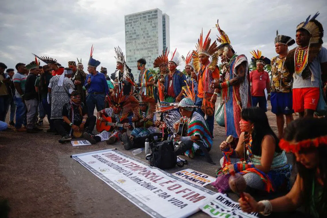 FILE PHOTO: Brazilian indigenous peoples gather as the Supreme Court on weighing the constitutionality of laws to limit the ability of Indigenous peoples to win protected status for ancestral lands, in Brasilia, Brazil August 30, 2023. REUTERS/Adriano Machado/File Photo