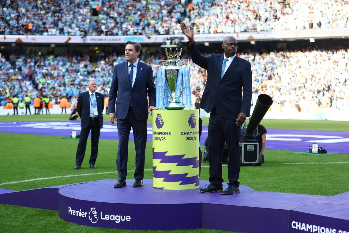 Soccer Football - Premier League - Manchester City v Chelsea - Etihad Stadium, Manchester, Britain - May 21, 2023 Premier League chief executive Richard Masters stands next to the Premier League trophy before the presentation REUTERS/Carl Recine/File Photo