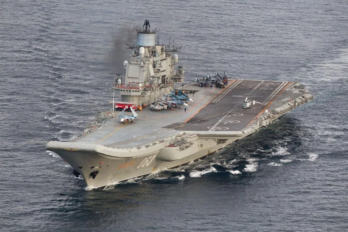 FILE PHOTO: A photo taken from a Norwegian surveillance aircraft shows Russian aircraft carrier Admiral Kuznetsov in international waters off the coast of Northern Norway on October 17, 2016. Handout via Reuters/File Photo