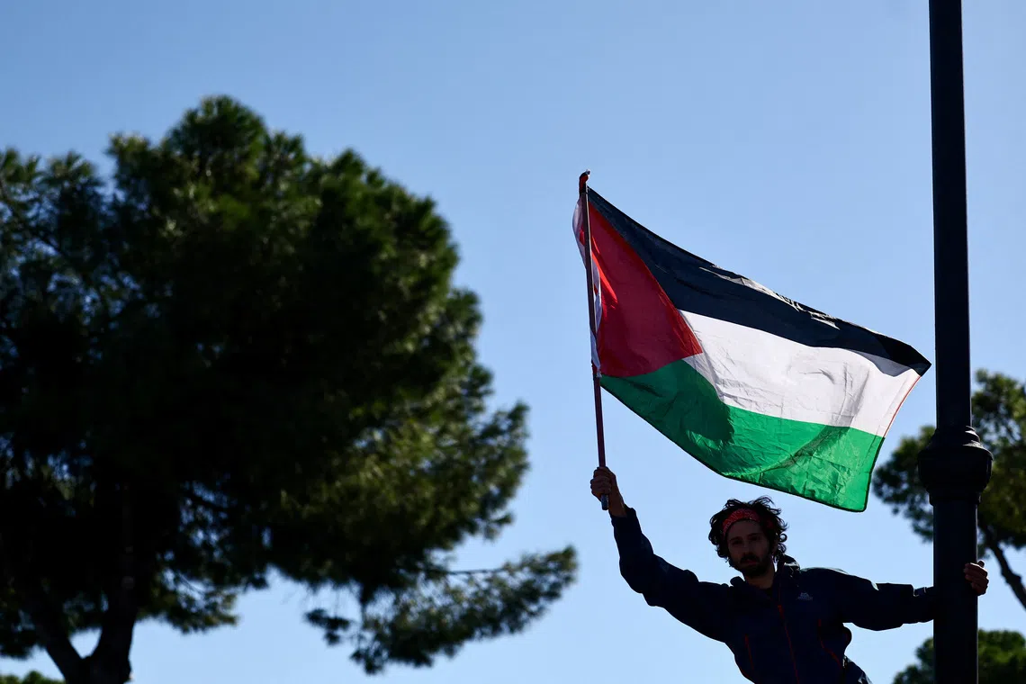 A pro-Palestinian demonstrator attends a protest during a nationwide strike called by the USB union to condemn the Israeli forces' interception of the vessels of the Global Sumud Flotilla aiming to reach Gaza and break Israel's naval blockade, in Rome, Italy, October 3, 2025. REUTERS/Yara Nardi