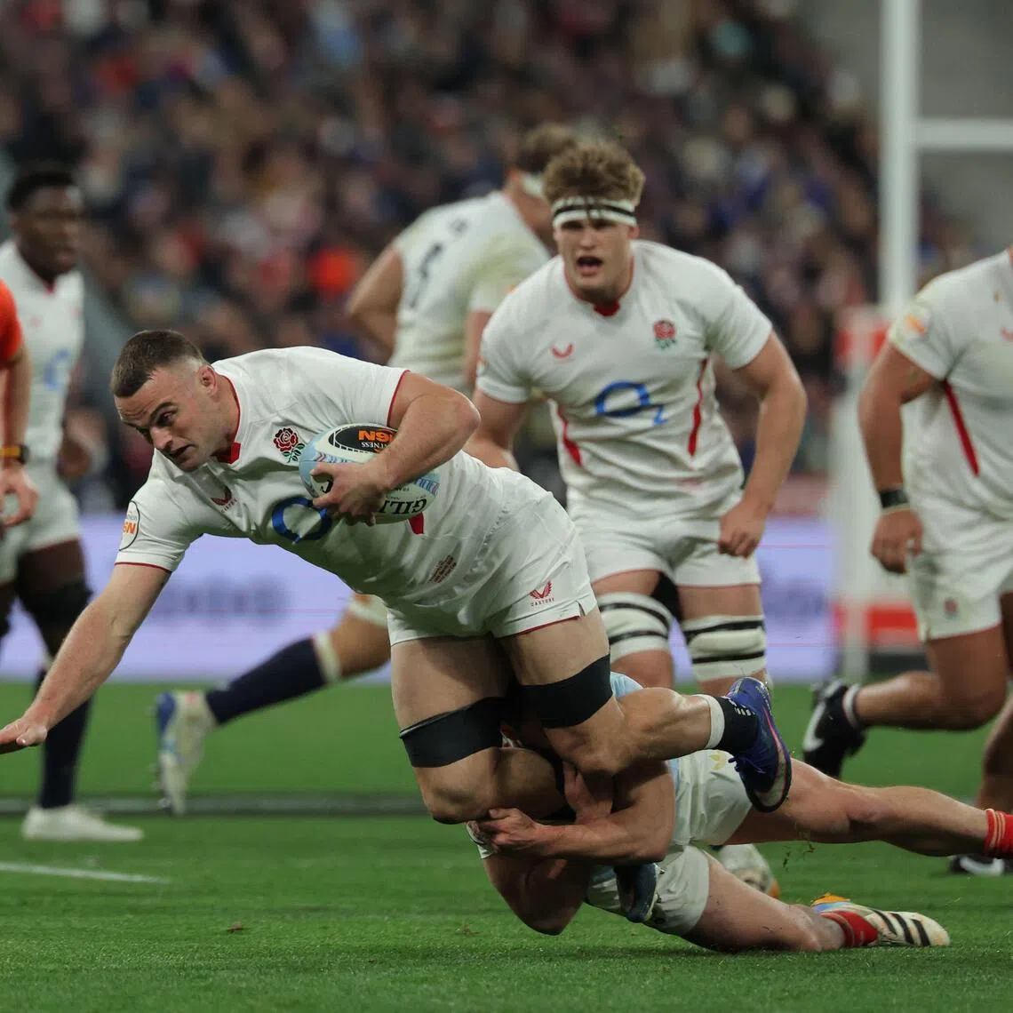 England's flanker Ben Earl is tackled as he runs with the ball during of the Six Nations match against France.