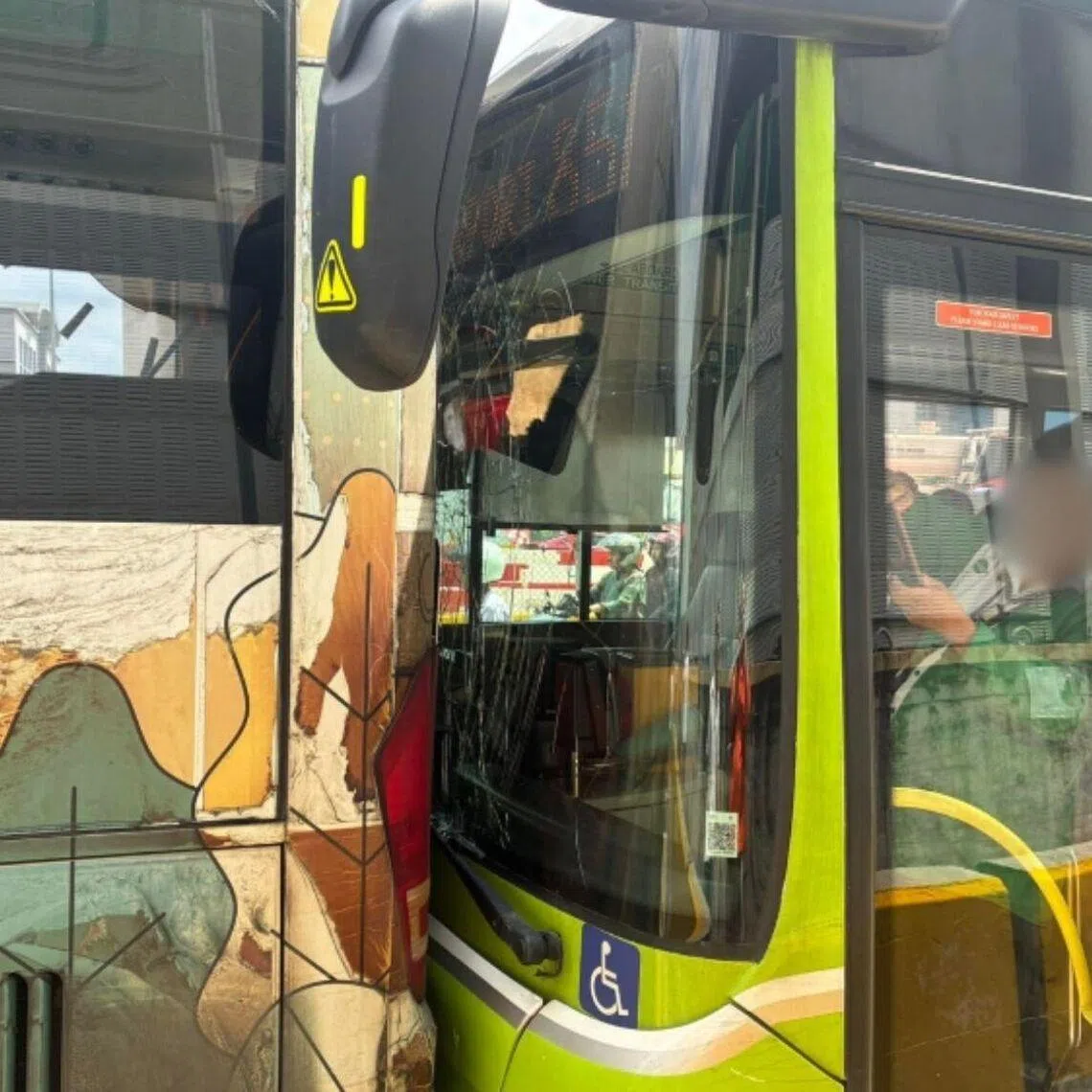 The collision left the Tower Transit bus with a cracked windscreen, while the shuttle bus' rear window shattered.