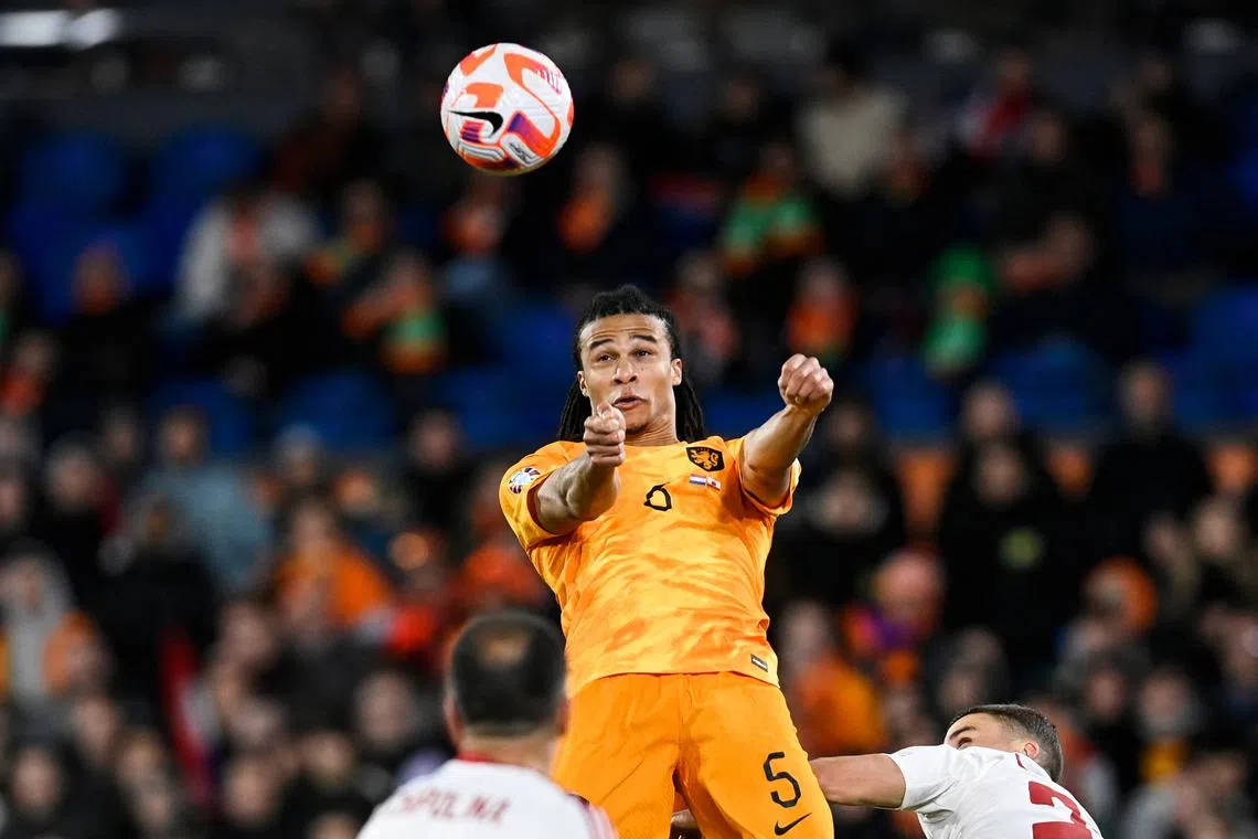 Netherlands' defender Nathan Ake goes for a header on March 27, 2023.