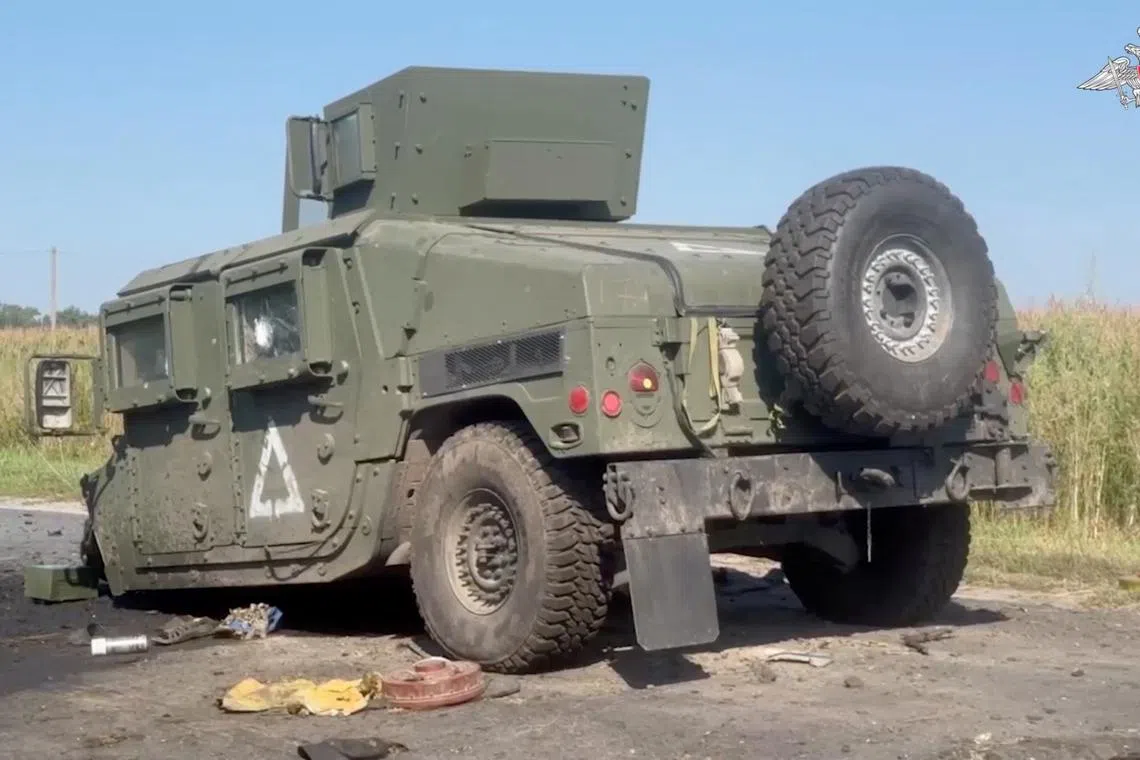 A view shows a damaged HMMWV (Humvee), what is said to be a vehicle of a Ukrainian military convoy destroyed by soldiers of the Russian naval infantry in the course of Russia-Ukraine conflict in the Kursk region, Russia, in this still image from video released August 20, 2024. Russian Defence Ministry/Handout via REUTERS