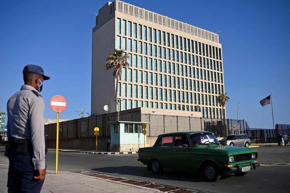 A police officer stands guard across the street from the US embassy in Havana.