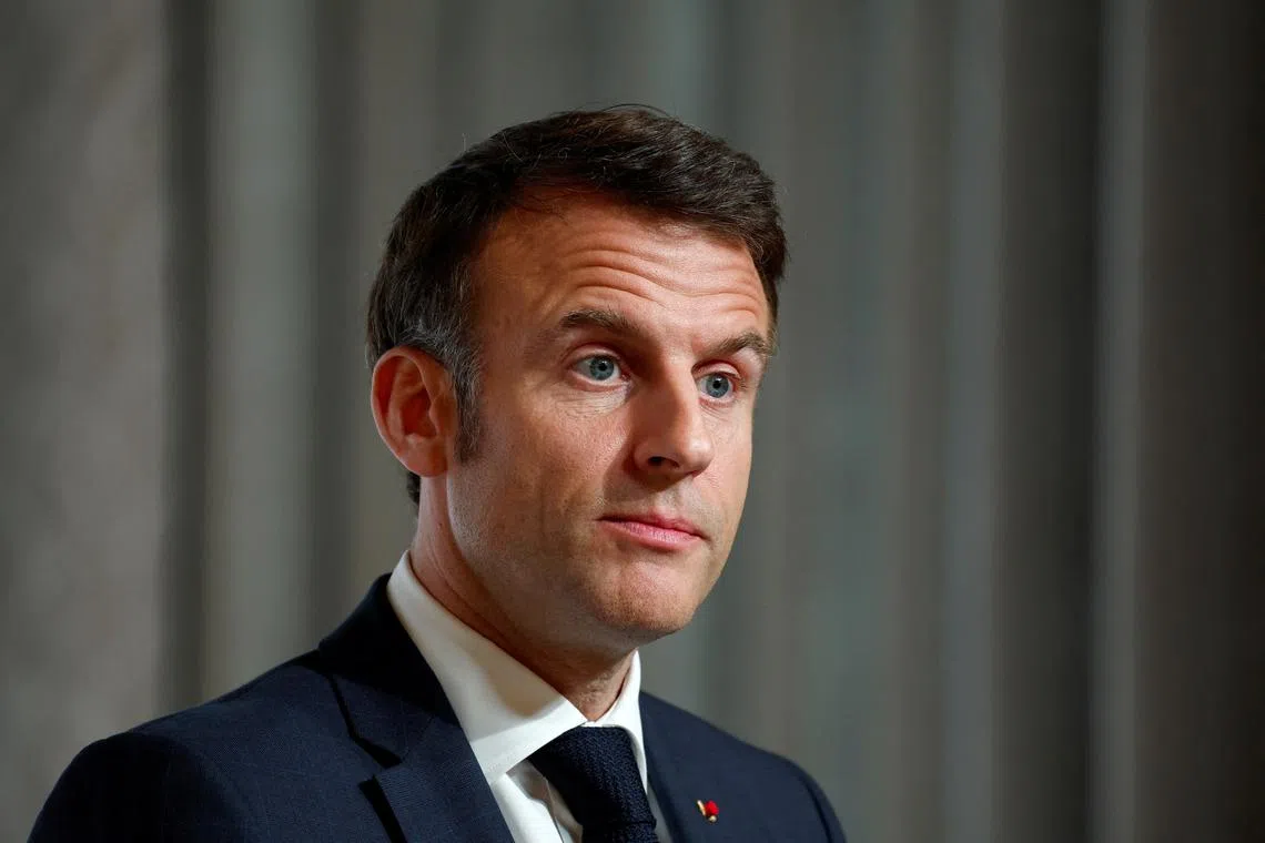 FILE PHOTO: French President Emmanuel Macron attends a press conference at the end of the conference in support of Ukraine, with European leaders and government representatives, at the Elysee Palace in Paris, France, February 26, 2024. REUTERS/Gonzalo Fuentes/Pool/File Photo