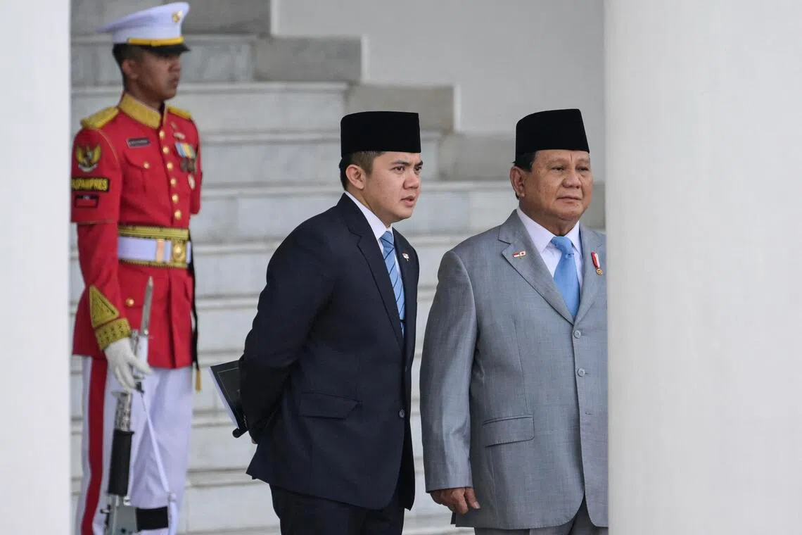 Indonesia's President Prabowo Subianto (R) and his Cabinet Secretary Teddy Indra Wijaya (C) wait for the arrival Japan's Prime Minister Shigeru Ishiba at the presidential palace in Bogor, West Java, on January 11, 2025. (Photo by BAY ISMOYO / AFP)