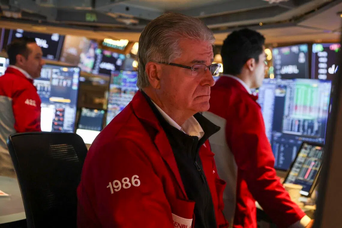 Traders working on the floor of the New York Stock Exchange on Oct 6, before the closing bell, in New York City.