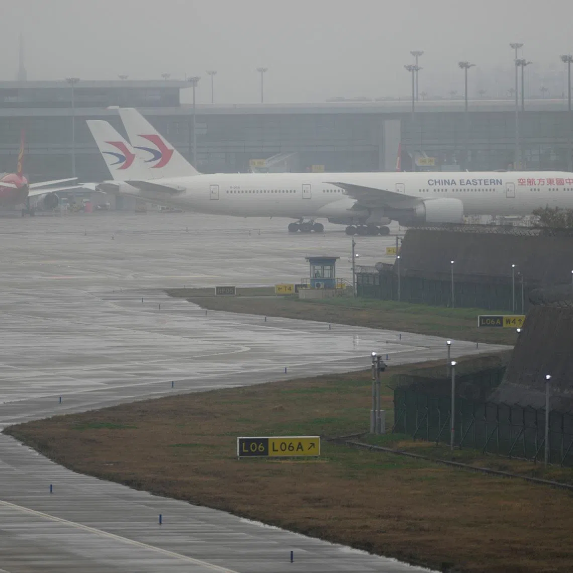 China Eastern Airlines aircrafts are parked at Pudong International Airport in Shanghai, China, March 21, 2023. REUTERS/Aly Song