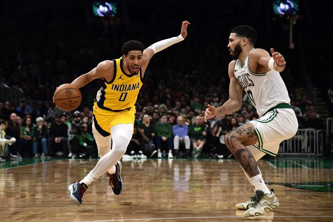 Indiana Pacers guard Tyrese Haliburton controlling the ball while Boston Celtics forward Jayson Tatum defends during the second half at TD Garden on Dec 29. Haliburton scored 31 points in a 123-114 victory.