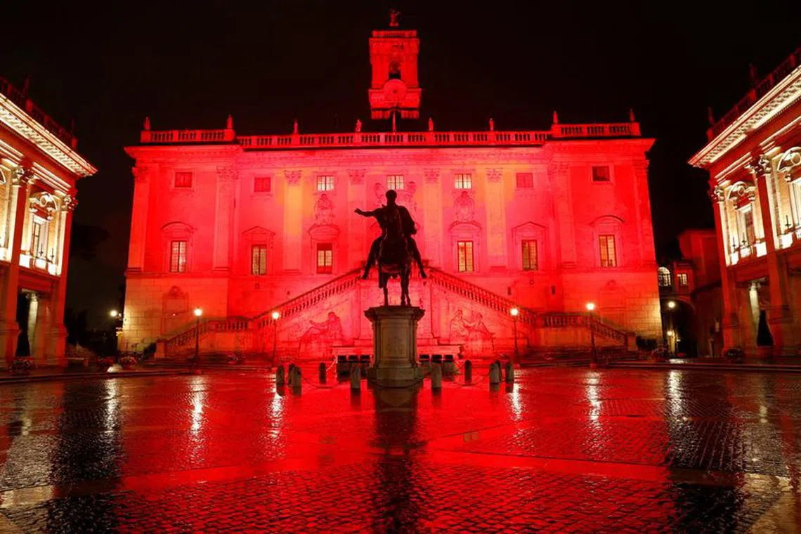 FILE PHOTO: The Campidoglio, Rome's city hall, is lit up in red to honour women who have been killed by men to mark International Day for the Elimination of Violence Against Women, in Rome, Italy, November 25, 2021. REUTERS/Remo Casilli/File Photo