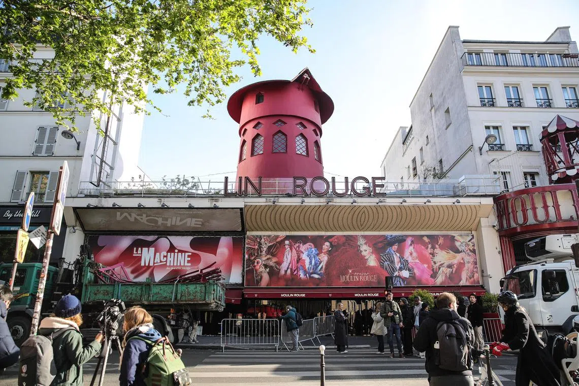 In the early hours of April 25, the sails of the landmark red windmill above the Moulin Rouge in Paris gave way and fell on the boulevard below. No one was injured.