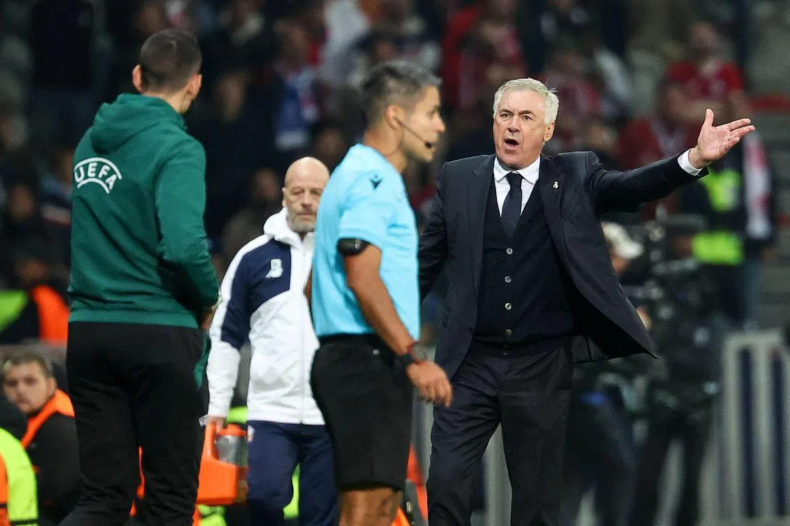 Real Madrid coach Carlo Ancelotti argues with officials during the Champions League match against Lille.