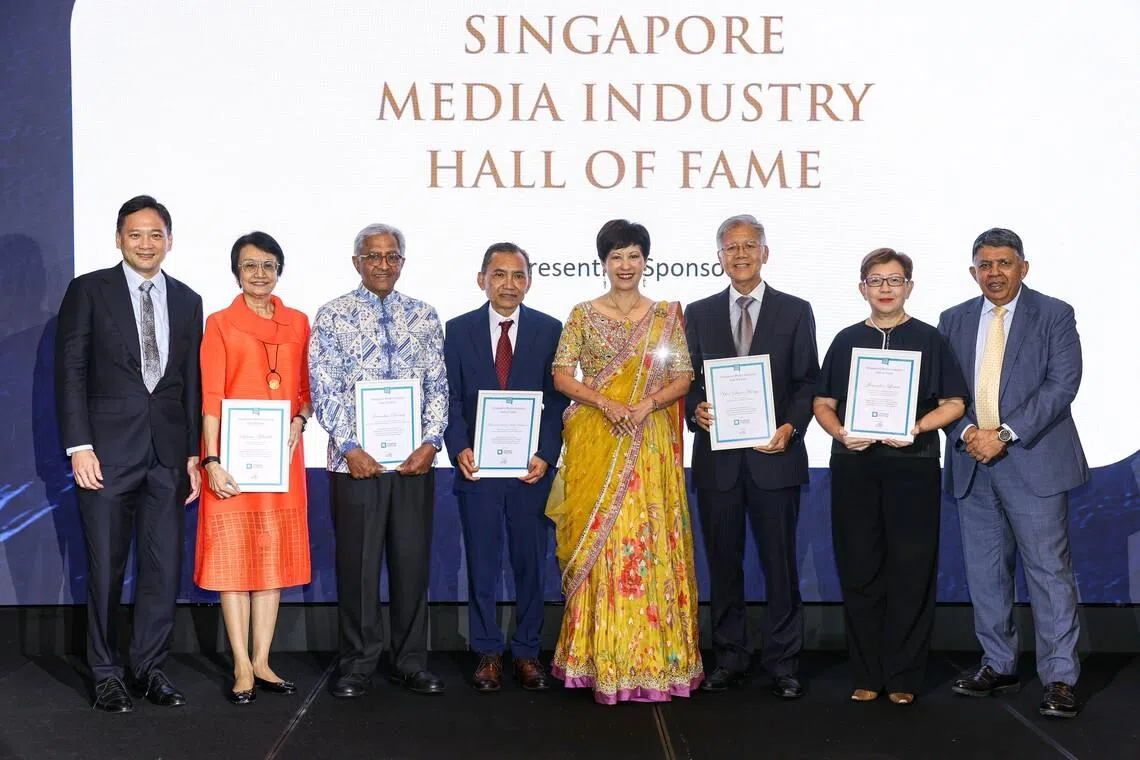 Managing director and head of financial institutions (Singapore) at Citi Koay Keng Huat (left), Minister in the Prime Minister’s Office Indranee Rajah (centre) and Singapore Press Club president Patrick Daniel (right) taking a group photo with Singapore Media Industry Hall of Fame inductees (from left) ST former senior health correspondent Salma Khalik, ST former associate editor Janadas Devan, Berita Harian former editor Mohamed Sa’at Abdul Rahman, Lianhe Zaobao former executive editor Yeo Swee Hong, and former news editor at Mediacorp and Straits Times TV Jennifer Lewis at the Singapore Press Club Awards on July 15.