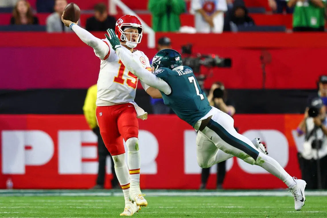 Kansas City Chiefs quarterback Patrick Mahomes passing the ball against Philadelphia Eagles linebacker Haason Reddick during Super Bowl LVII. American football is making a push to be included in the Olympics.