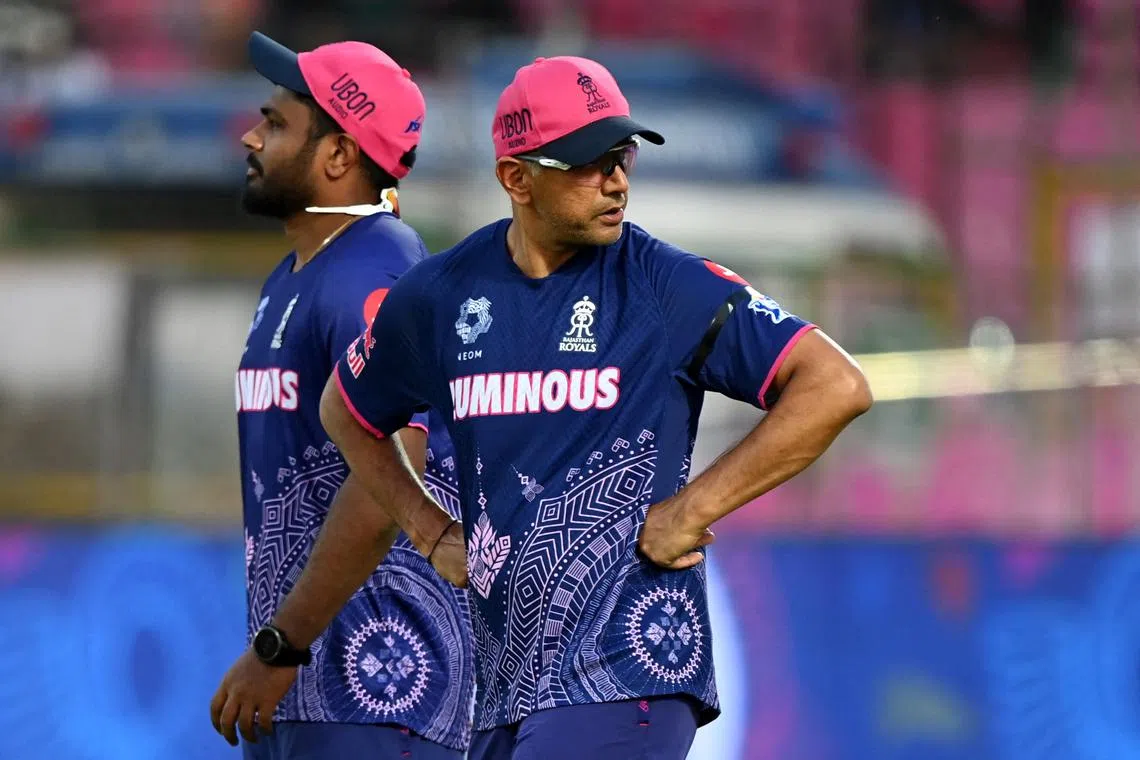 FILE PHOTO: Cricket - Indian Premier League - IPL - Rajasthan Royals v Gujarat Titans - Sawai Mansingh Stadium, Jaipur, India - April 28, 2025 Rajasthan Royals head coach Rahul Dravid with Sanju Samson during the warm up before the match REUTERS/Abhijit Addya/ File Photo