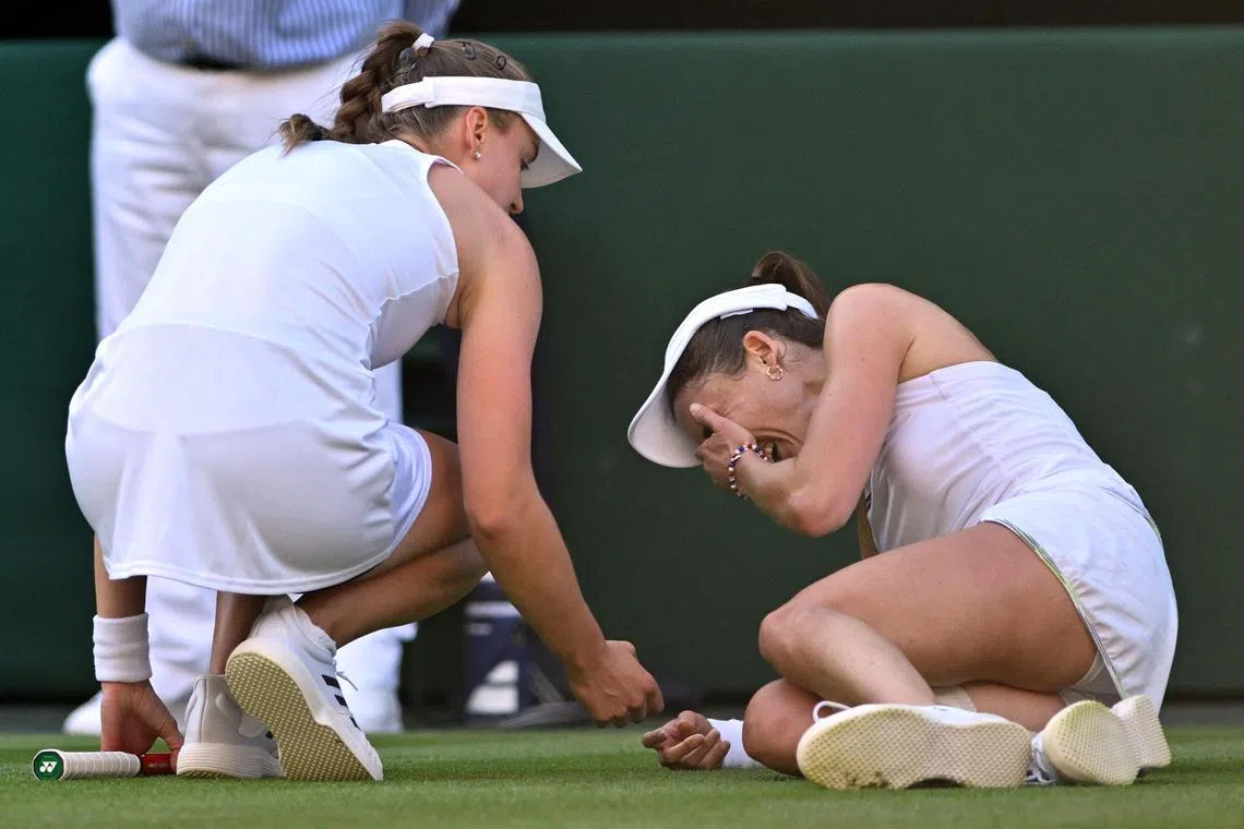 France's Alize Cornet crying after suffering a knee injury during her Wimbledon second-round match against defending champion Elena Rybakina of Kazakhstan.