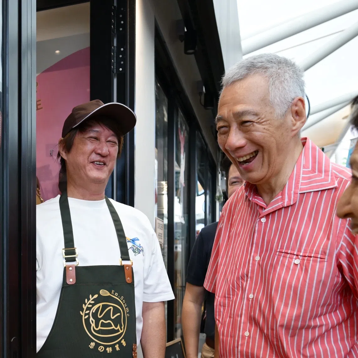 Senior Minister Lee Hsien Loong with En.Souffle owner Spencer Chan, 55, during a tour of Sprouts@AMK on Sept 21.