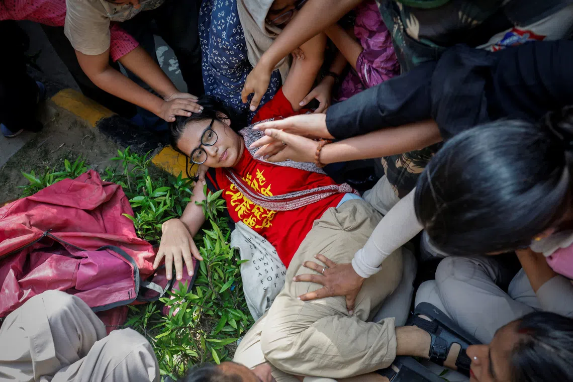 Neha Bora being detained by police during a protest in New Delhi, India, on Oct 2.