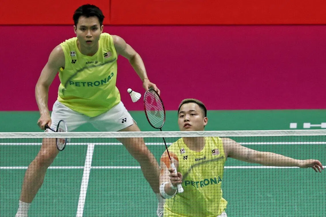 Aaron Chia (right) and Soh Wooi Yik of Malaysia during their doubles final against Liang Wei Keng and Wang Chang of China at the World Championships in New Delhi on Aug 23.