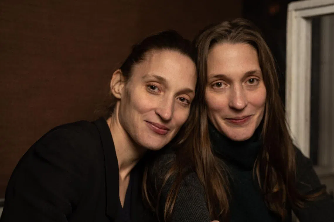 Jean Garnett (left), an editor at Little, Brown & Co, and her identical twin sister Callie, are always rooting for each other. 