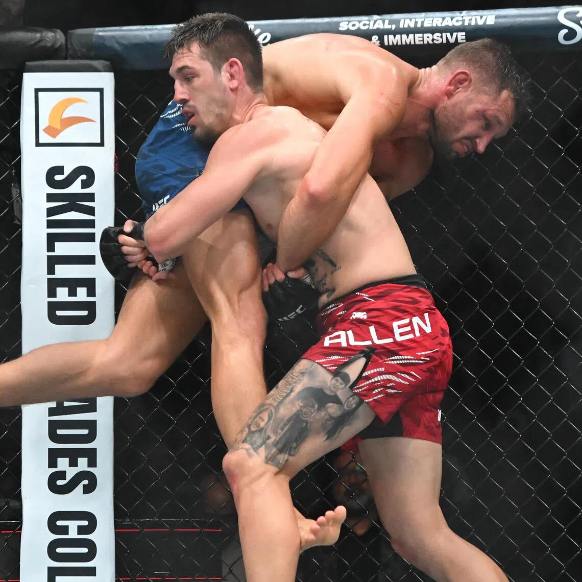 Brendan Allen (in red shorts) gaining the upper hand over Reinier de Ridder during UFC Fight Night at Rogers Arena on Oct 18 night.