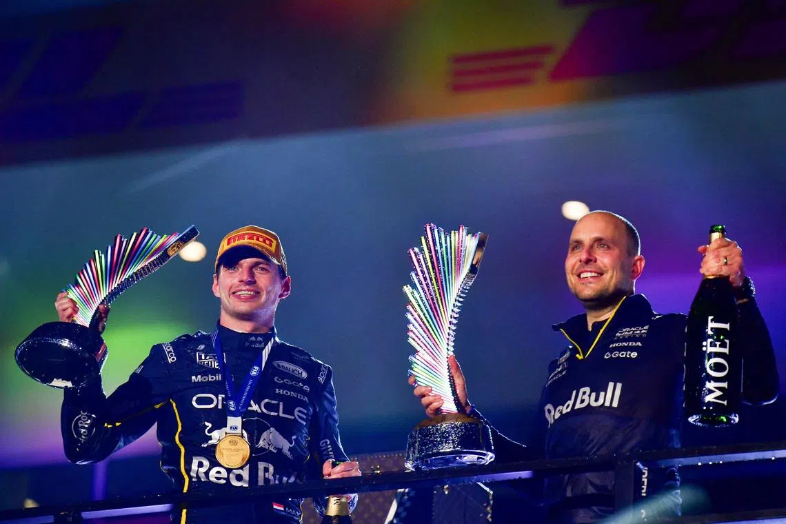 Nov 21, 2025; Las Vegas, NV, USA; Red Bull Racing driver Max Verstappen (1) celebrates his victory with race engineer Gianpiero Lambiase at Las Vegas Strip Circuit. Mandatory Credit: Gary A. Vasquez-Imagn Images