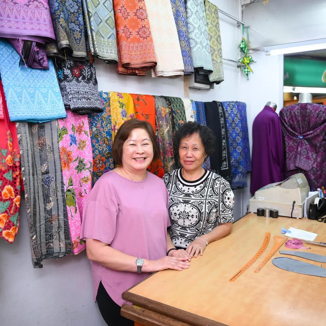 Sisters Madam Carol Chong (left) and Madam Cassandra Chong moved into Joo Chiat Complex when the building was completed in 1984, making them the first Chinese tailors. 
