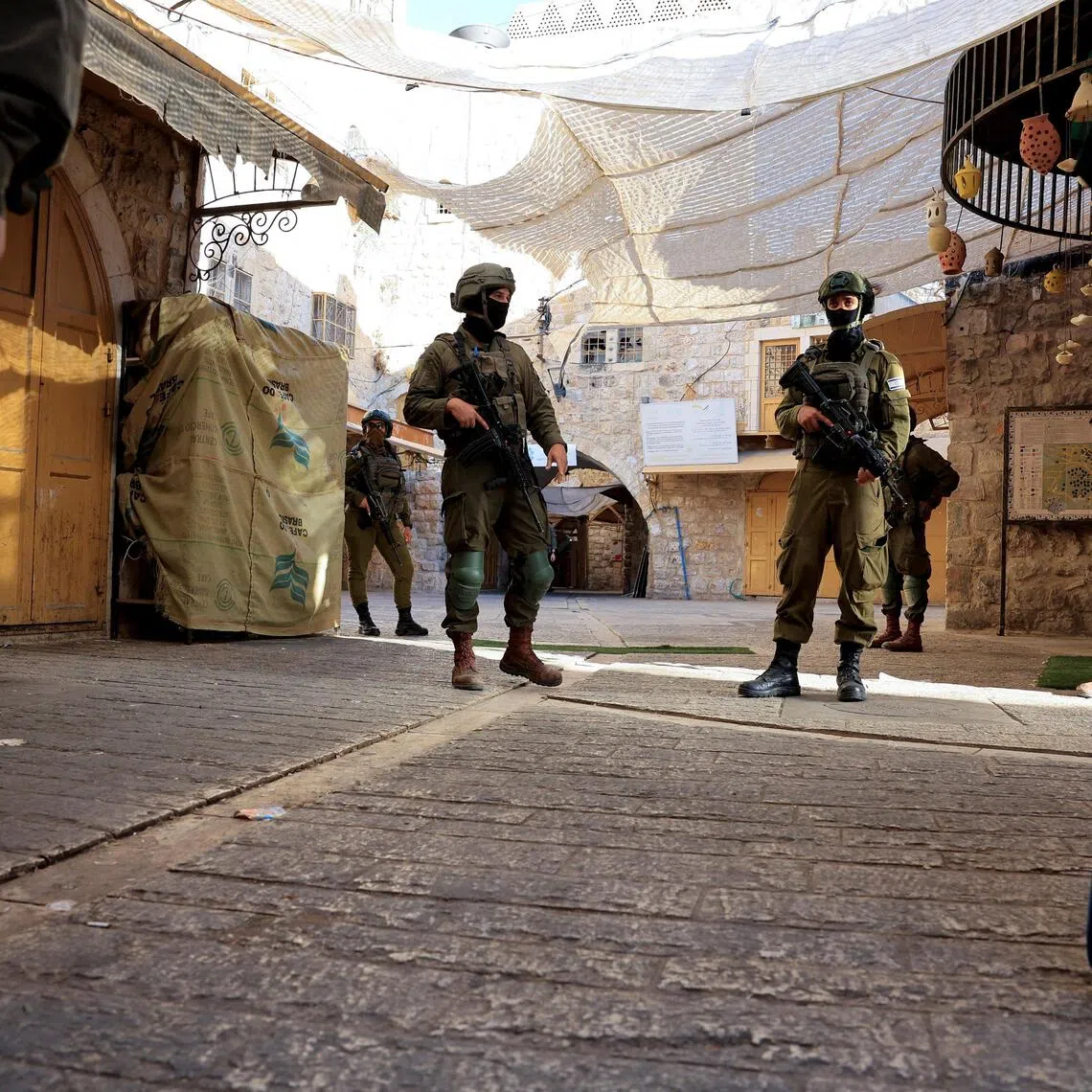 Israeli soldiers keeping watch during settlers’ weekly tour in Hebron, in the occupied West Bank on Sept 5.