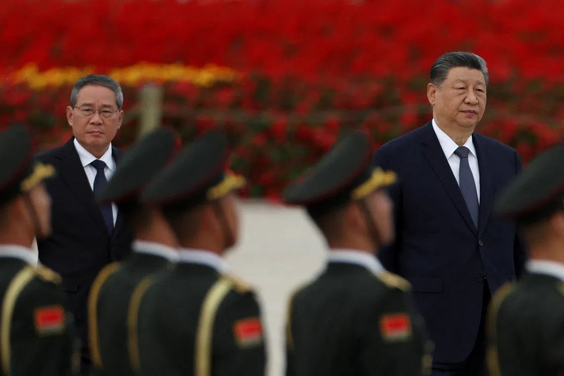 Chinese President Xi Jinping and Premier Li Qiang arrive for a ceremony to mark Martyrs' Day, a day ahead of the Chinese National Day, on Tiananmen Square in Beijing, China September 30, 2026. REUTERS/Florence Lo